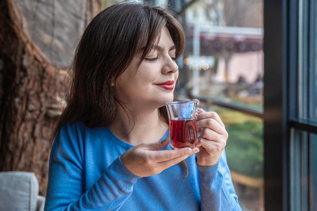 Midlife sleep changes. Woman sipping herbal tea